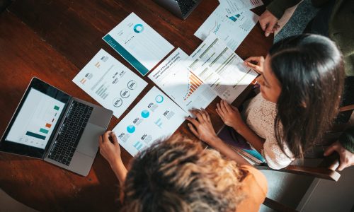 Group of millennials working in the office. Young creative team cooperating on new commitments.